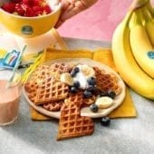 Chiquita banana waffles with blueberries and whipped cream